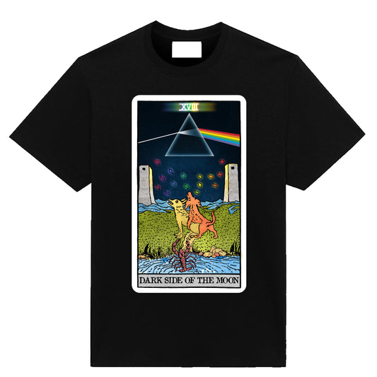 Black graphic T-shirt featuring a psychedelic Moon tarot card with a glowing prism, rainbow, two dogs, towers, and a scorpion.