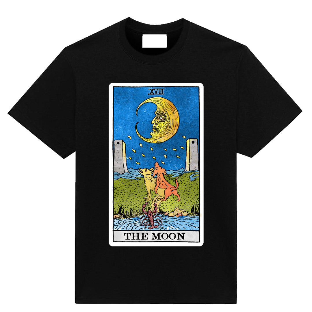 Black t-shirt featuring The Moon tarot card illustration with crescent moon, twin towers, and symbolic figures, designed by Neesh Labs