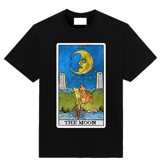 Black t-shirt featuring The Moon tarot card illustration with crescent moon, twin towers, and symbolic figures, designed by Neesh Labs